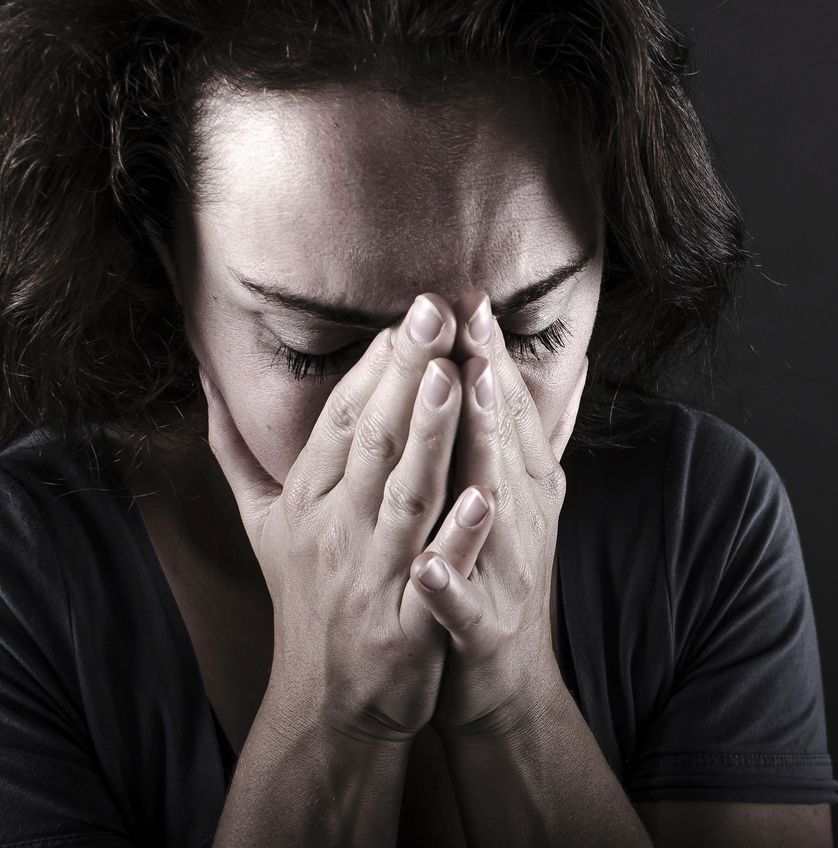 Woman covering her face, reflecting the anxiety and self-criticism described in the client story